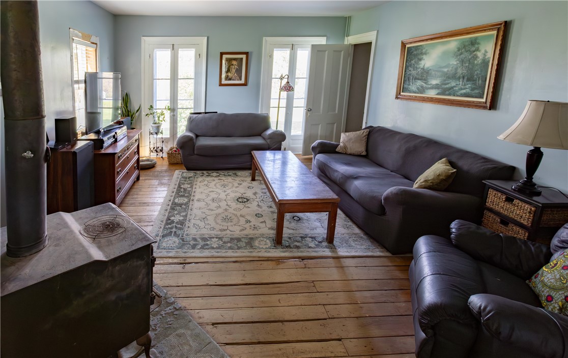 953 Howland Road Manchester, NY 14548 - Photo 13 of 40 living room w/wood stove