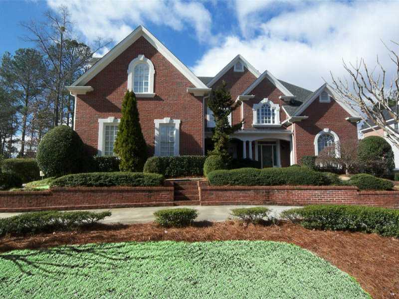 4790 Old Timber Ridge Road Marietta, GA 30068 - Photo 1 of 1 Exterior Front. Solid Four-Sided Executive Brick home with circular driveway and three car garage.