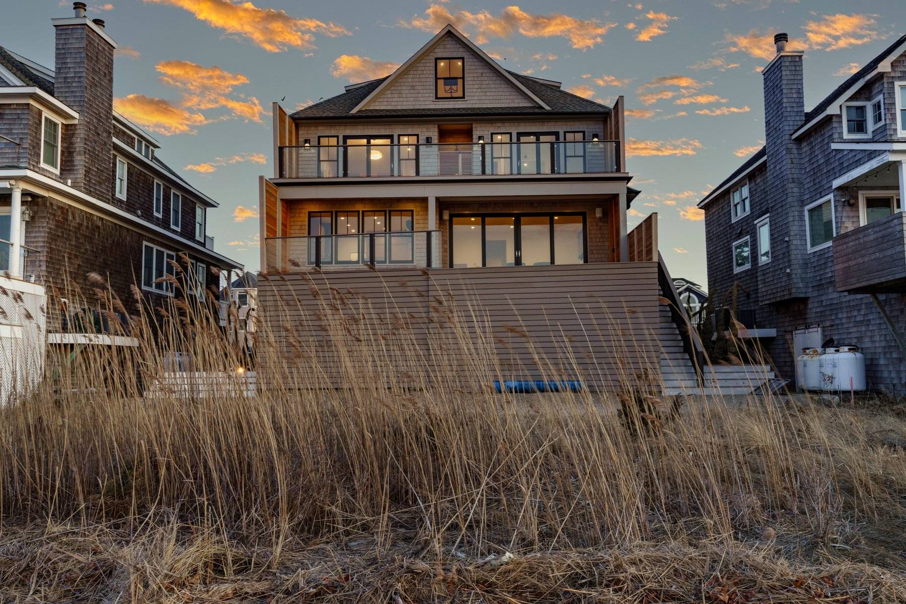 686 Dune Road Westhampton Beach, NY 11978 - Photo 33 of 37 a front view of a house with a yard
