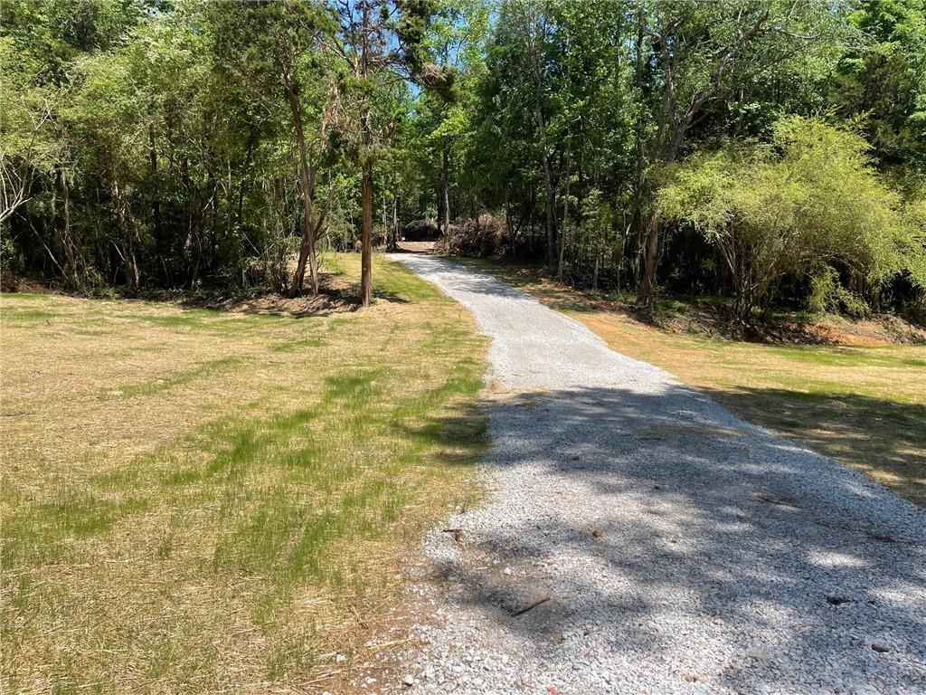 Lot 14 Chalcrest Way Cave Spring, GA 30124 - Photo 2 of 56 a swimming pool with trees in the background