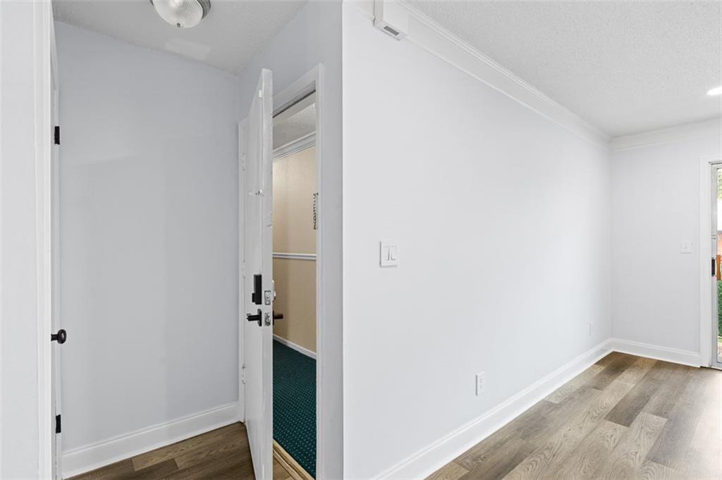 6851 Roswell Road, Unit N10 Atlanta, GA 30328 - Photo 11 of 26 a view of a hallway with wooden floor