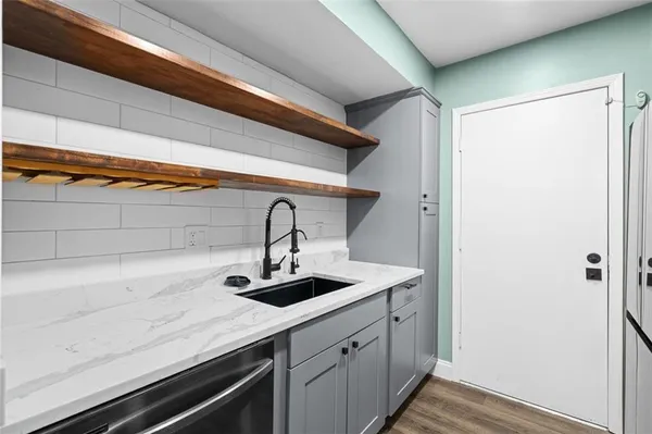 a kitchen with a sink and cabinets