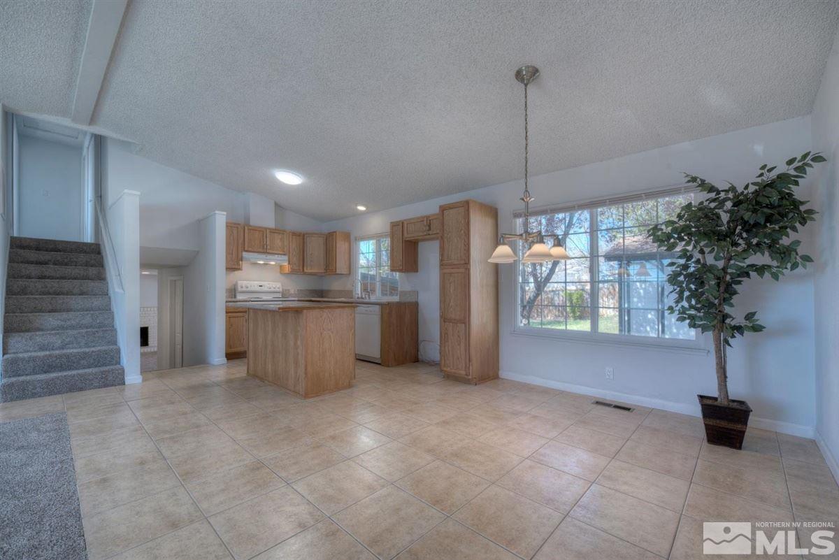 1645 Wyoming Avenue Reno, NV 89503 - Photo 11 of 28 a kitchen with refrigerator and window