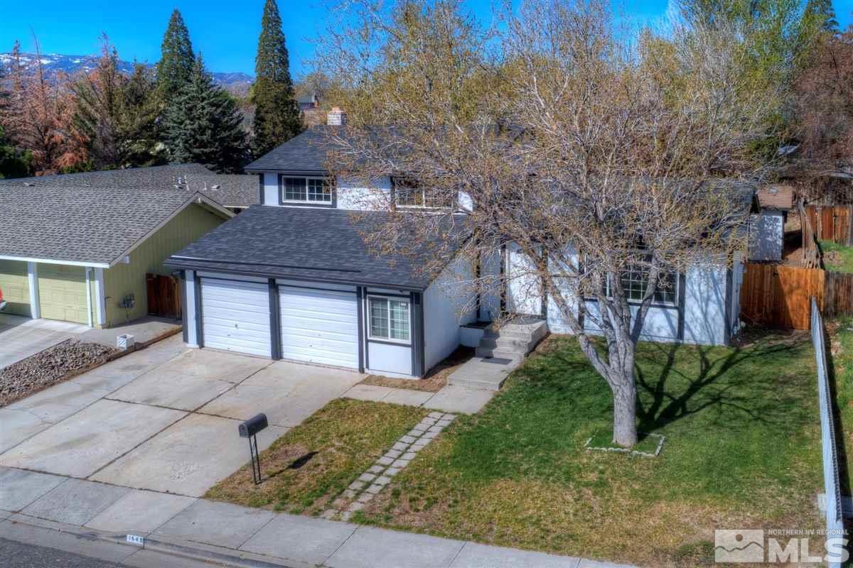 1645 Wyoming Avenue Reno, NV 89503 - Photo 2 of 28 a front view of a house with garden
