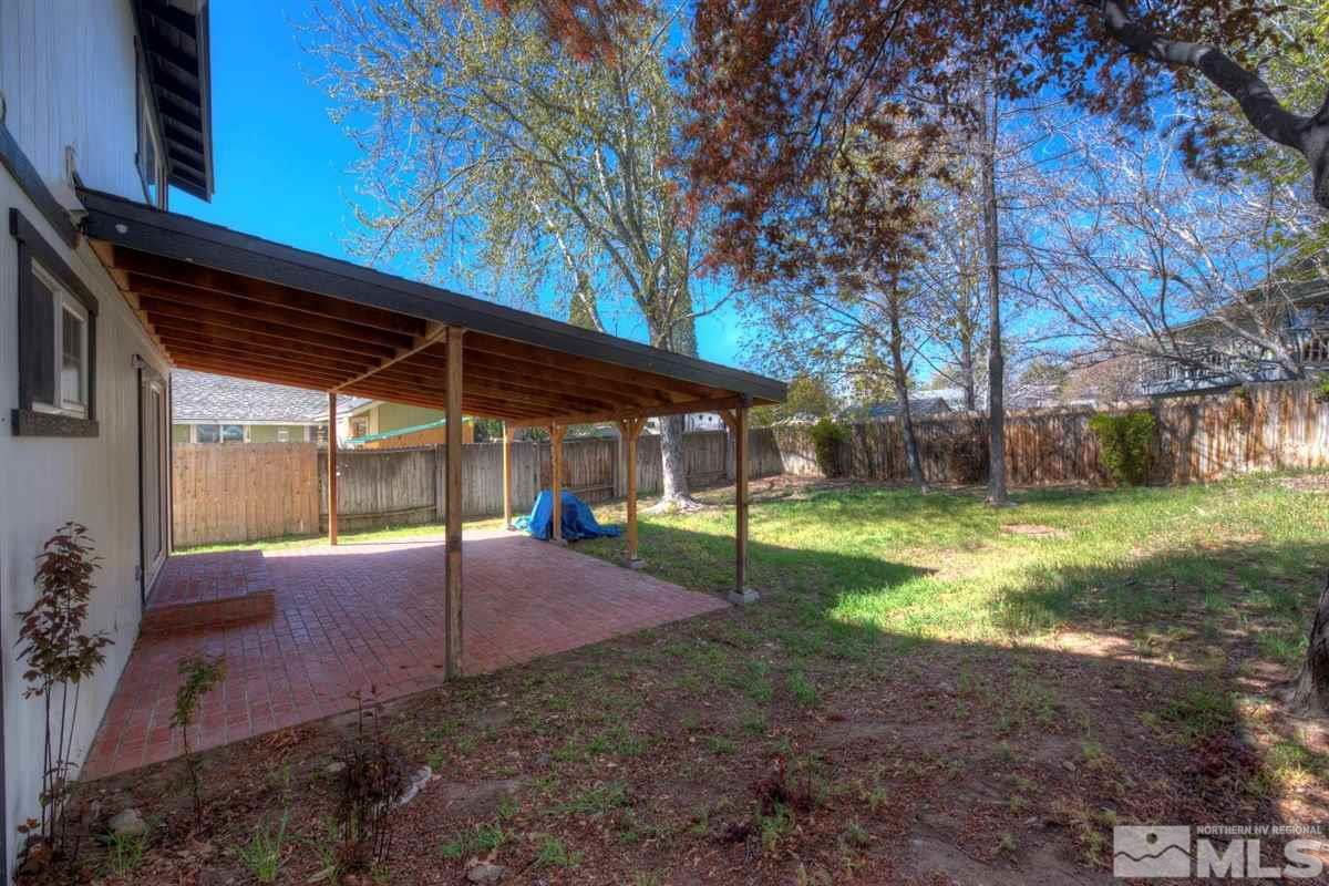 1645 Wyoming Avenue Reno, NV 89503 - Photo 6 of 28 a view of a house with backyard and tree