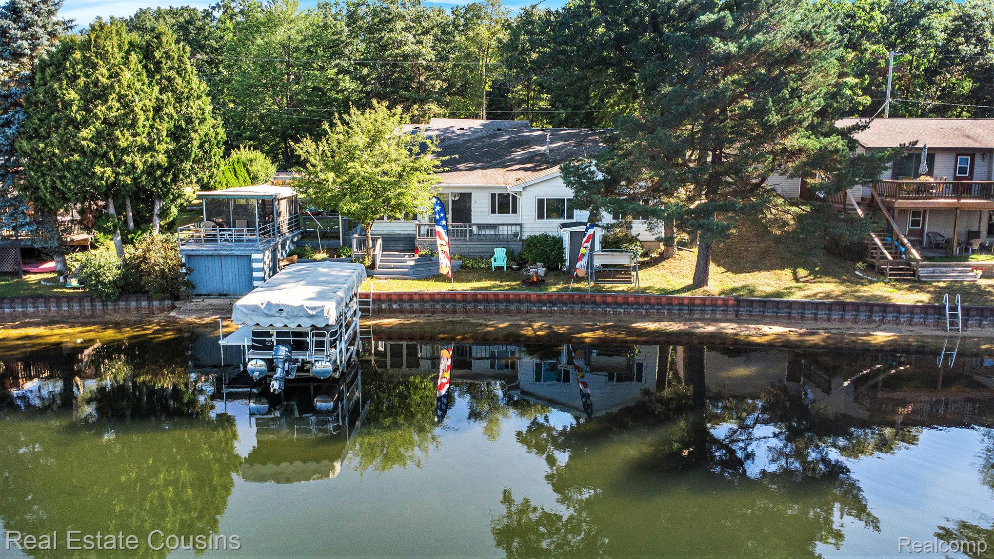 1734 Forest Road Harrison, MI 48625 - Photo 29 of 31 Dock with a water view and boat lift