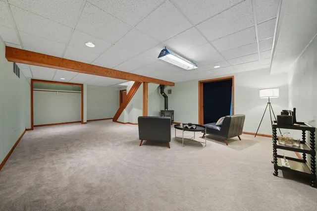 a living room with furniture a couch and a potted plant