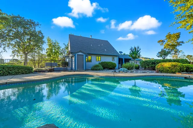 a view of a swimming pool with a garden