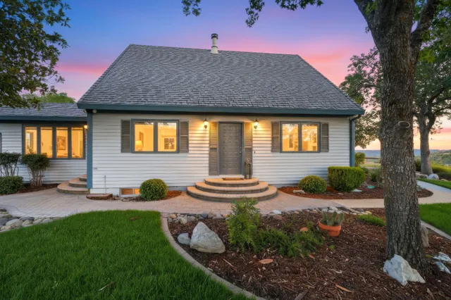 a front view of a house with garden