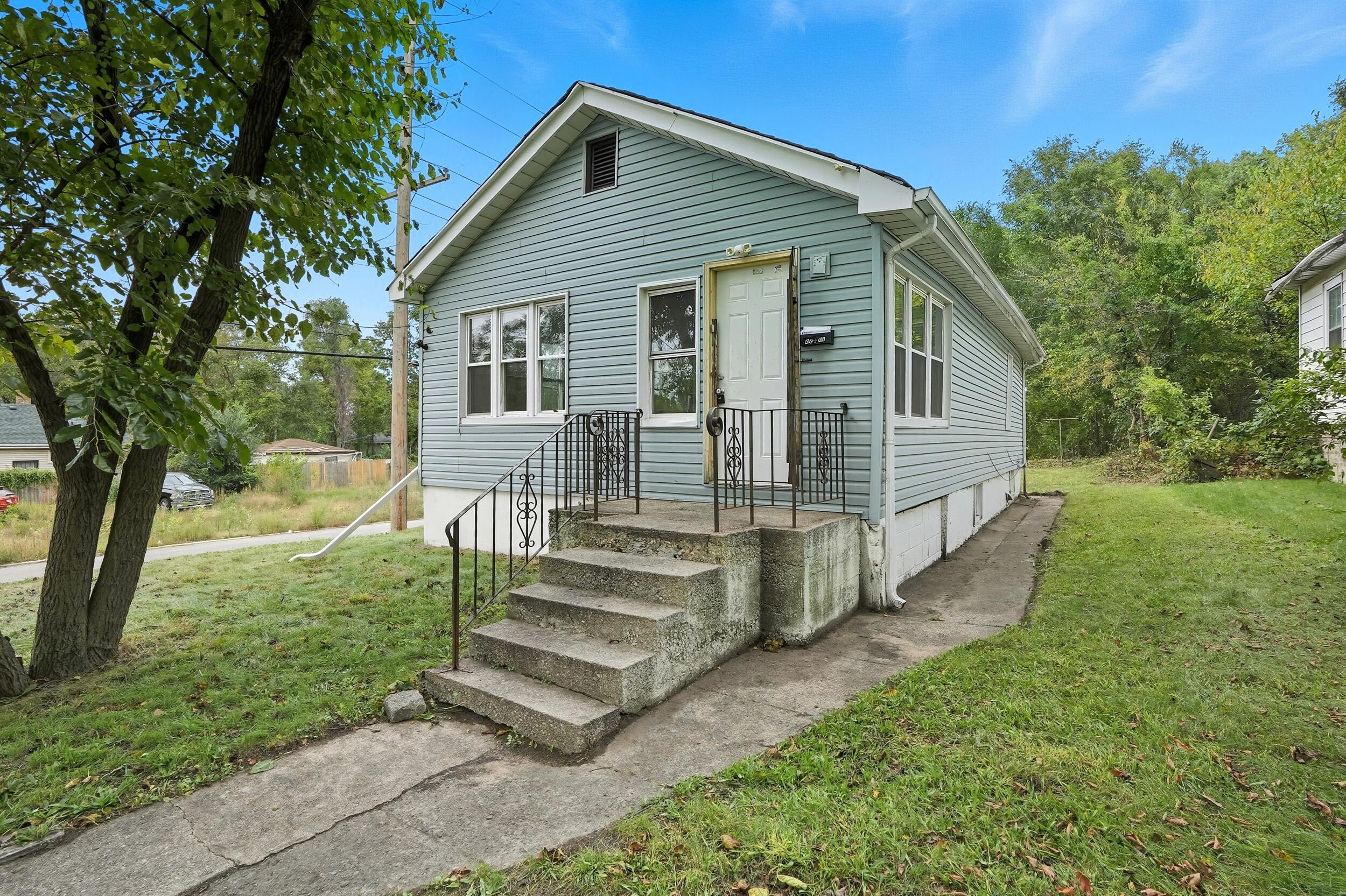 4001 Virginia Street Gary, IN 46409 - Photo 1 of 12 a view of a house with backyard