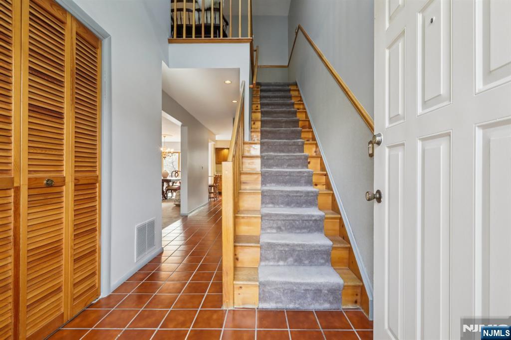 70 River Road, Unit C003 Clifton, NJ 07014 - Photo 3 of 35 a view of a hallway with wooden floor and windows