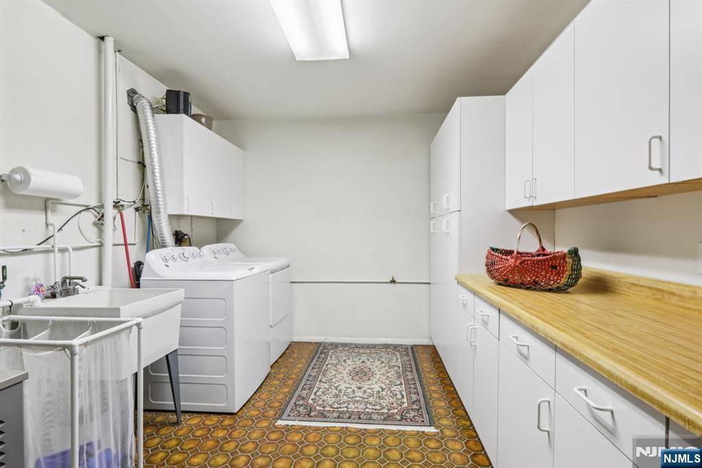 70 River Road, Unit C003 Clifton, NJ 07014 - Photo 31 of 35 a kitchen with a sink and a stove top oven