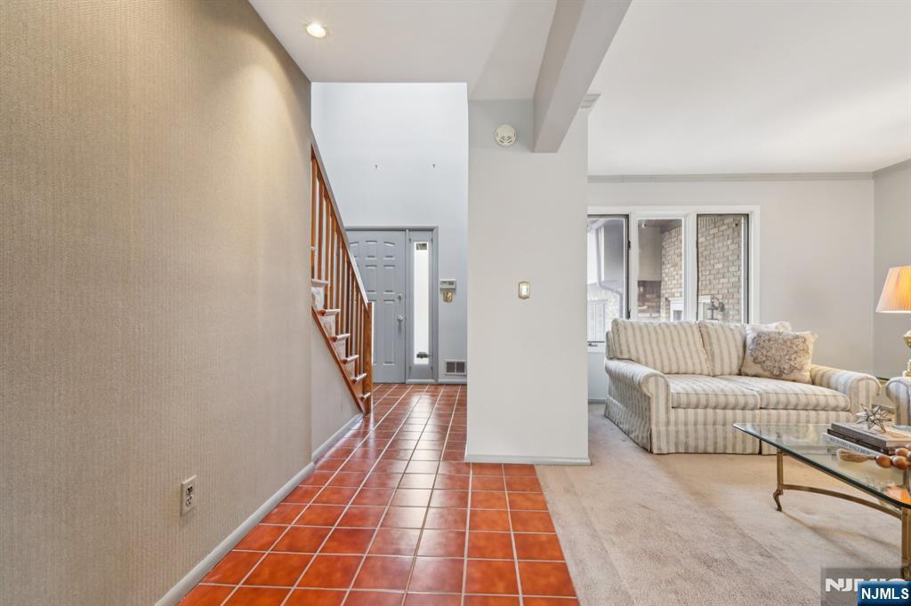 70 River Road, Unit C003 Clifton, NJ 07014 - Photo 5 of 35 a hallway with furniture and a rug
