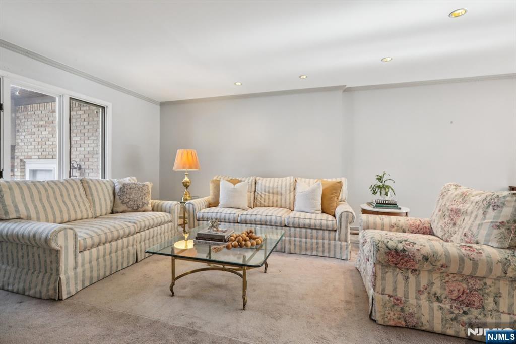 70 River Road, Unit C003 Clifton, NJ 07014 - Photo 7 of 35 a living room with furniture and a couch