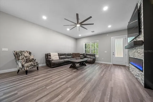 a kitchen with stainless steel appliances a stove microwave and refrigerator