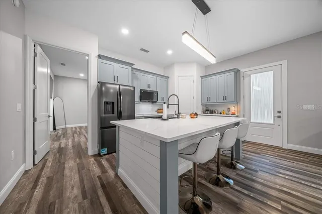 a kitchen with a sink and cabinets