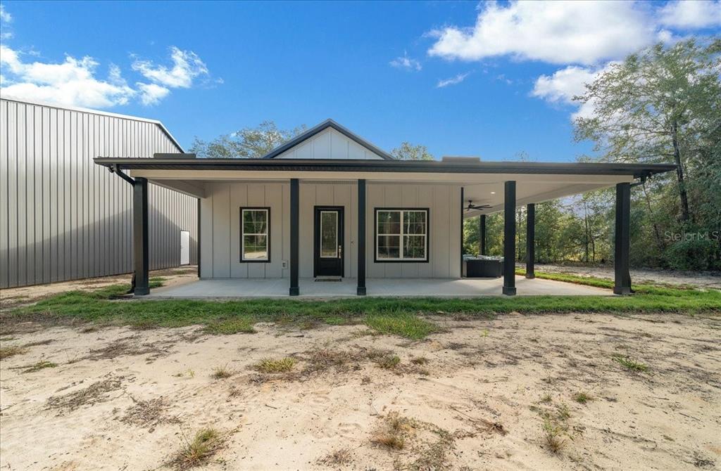 252 Malauka Road Ocklawaha, FL 32179 - Photo 2 of 78 a view of a house with a yard and large tree