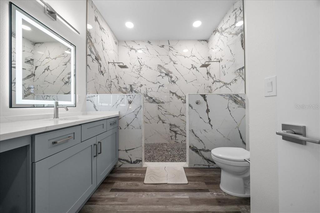 252 Malauka Road Ocklawaha, FL 32179 - Photo 29 of 78 a bathroom with a sink a toilet and shower