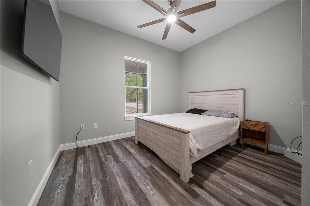 252 Malauka Road Ocklawaha, FL 32179 - Photo 33 of 78 a bedroom with a bed and window