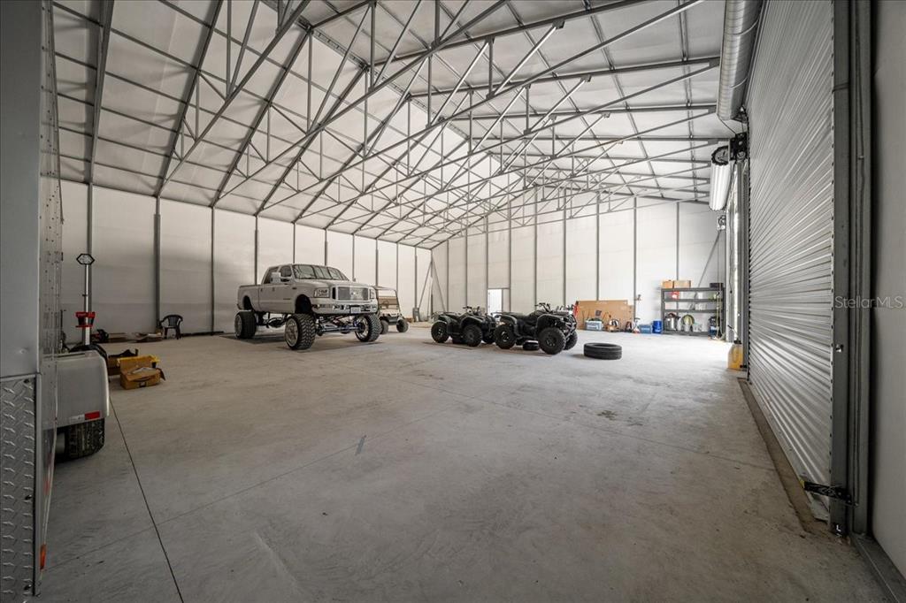 252 Malauka Road Ocklawaha, FL 32179 - Photo 43 of 78 a view of car parked in parking area of a house