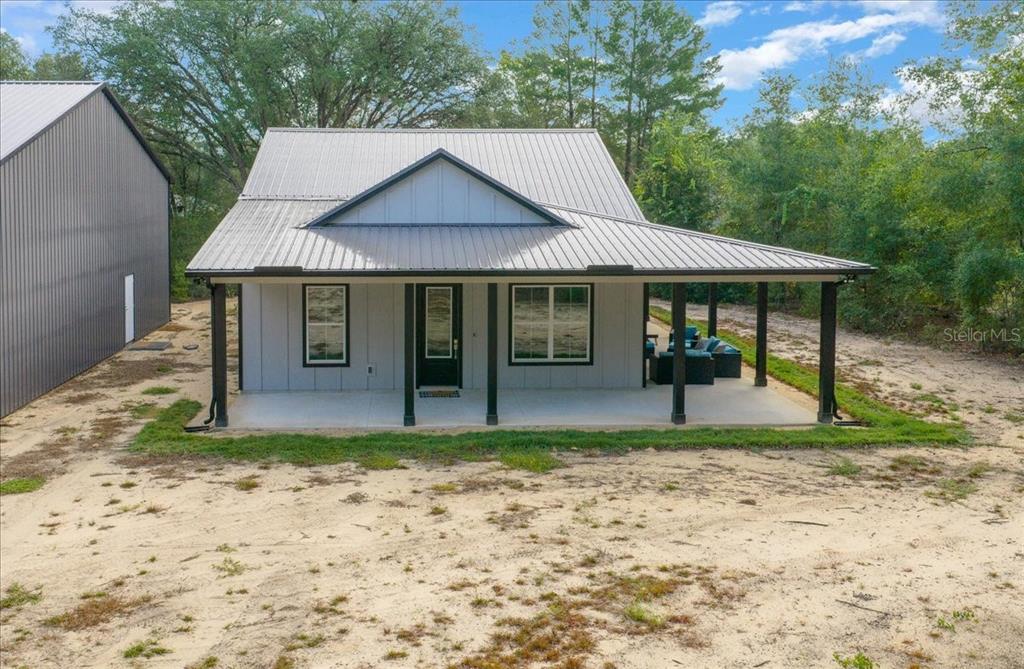 252 Malauka Road Ocklawaha, FL 32179 - Photo 47 of 78 a front view of a house with a yard