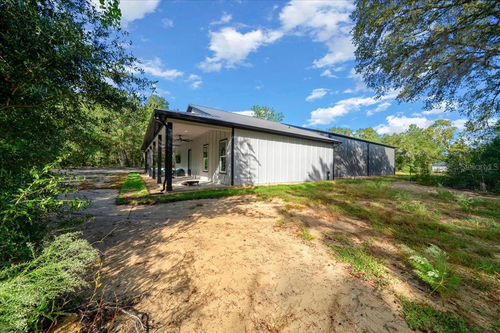 252 Malauka Road Ocklawaha, FL 32179 - Photo 49 of 78 a view of a house with backyard and tree