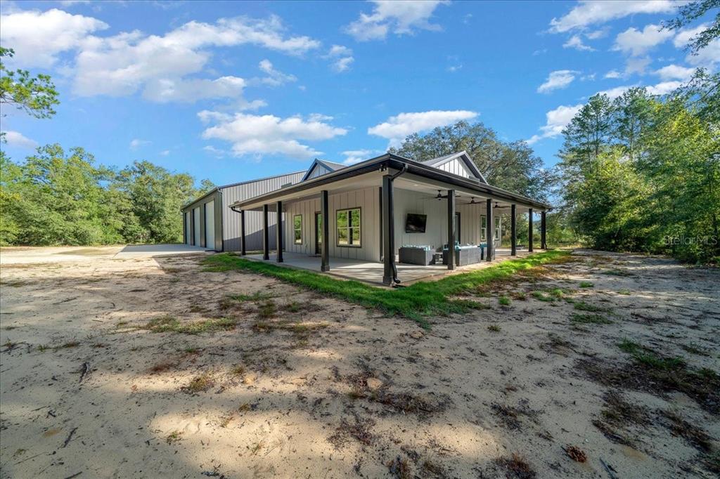 252 Malauka Road Ocklawaha, FL 32179 - Photo 51 of 78 a view of a house with a yard