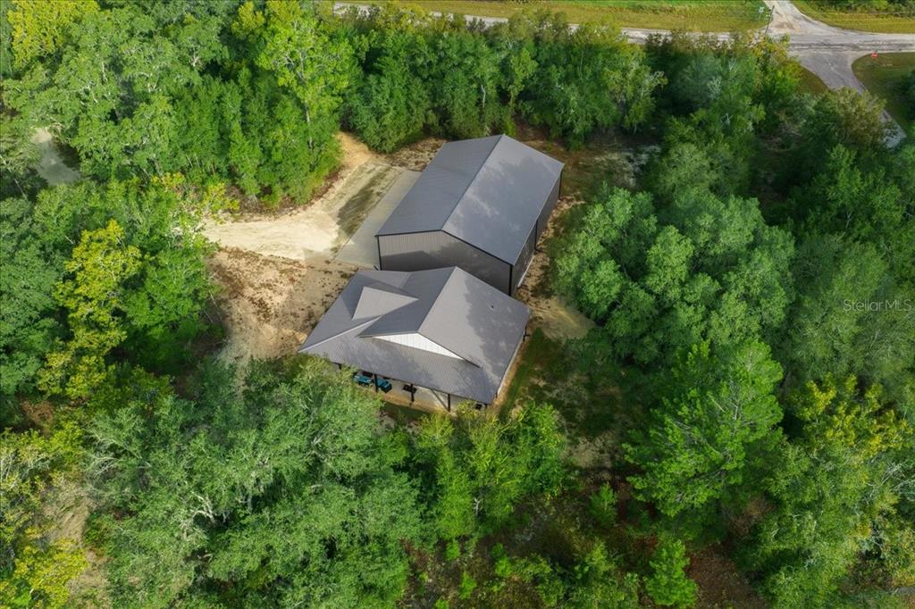 252 Malauka Road Ocklawaha, FL 32179 - Photo 64 of 78 an aerial view of a house with a yard and lake view