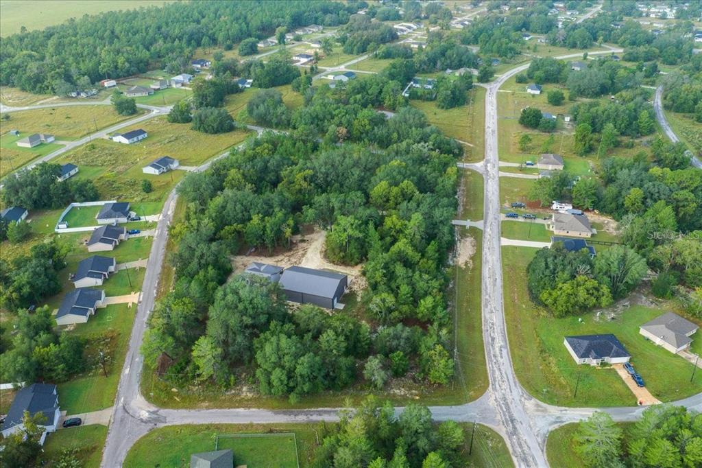 252 Malauka Road Ocklawaha, FL 32179 - Photo 69 of 78 an aerial view of residential house with outdoor space and swimming pool