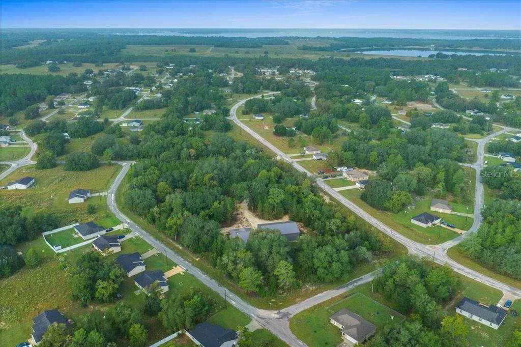 252 Malauka Road Ocklawaha, FL 32179 - Photo 78 of 78 an aerial view of residential houses with outdoor space and trees