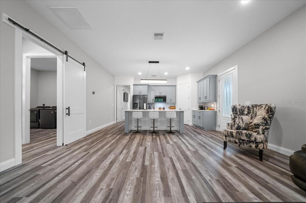 252 Malauka Road Ocklawaha, FL 32179 - Photo 10 of 78 a living room with furniture and a wooden floor