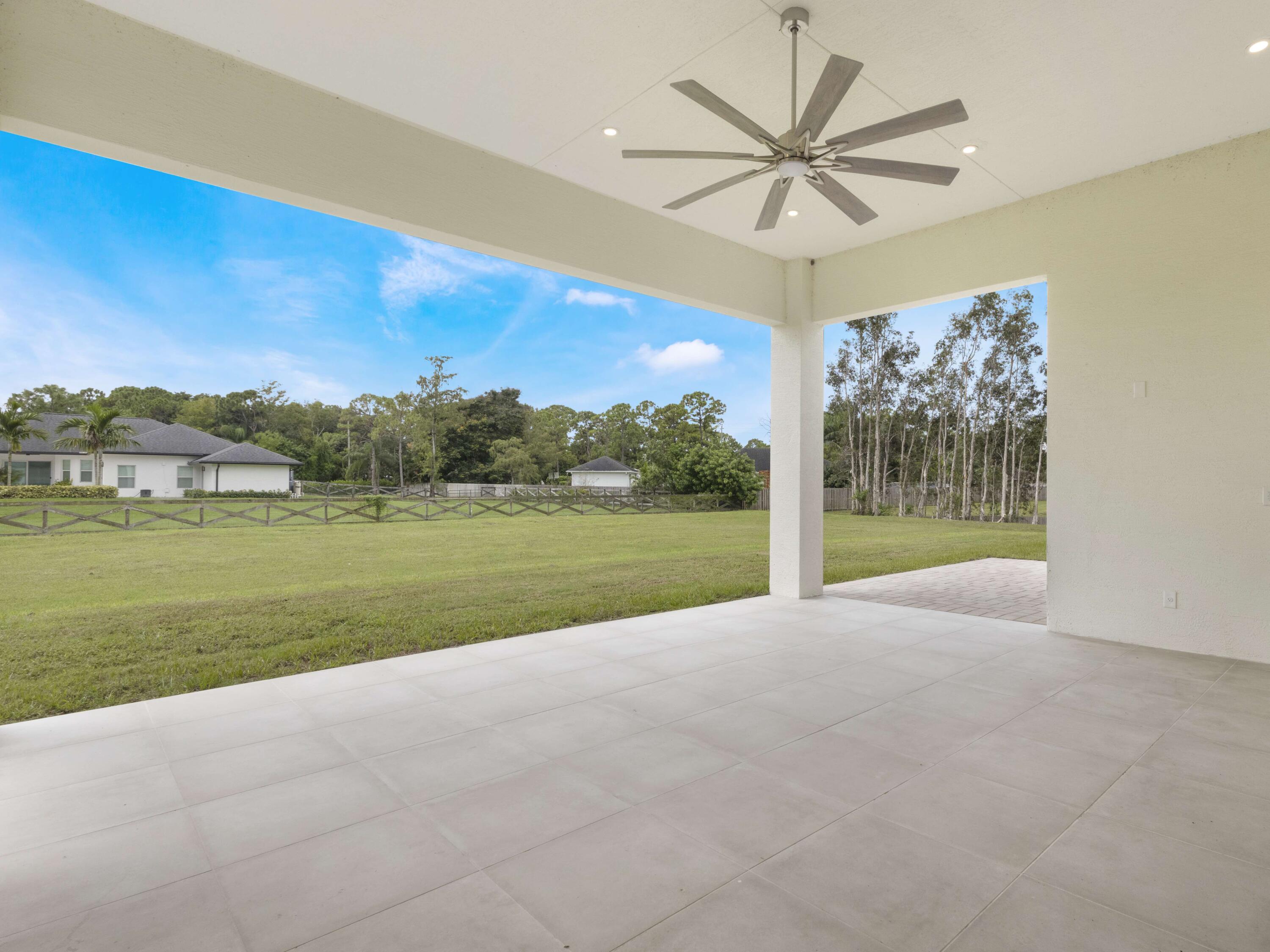 17436 71st Lane North Loxahatchee, FL 33470 - Photo 45 of 50 a view of a garden with an empty room and deck