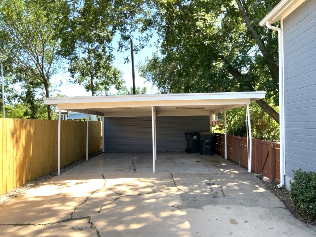 806 East 3rd Street Georgetown, TX 78626 - Photo 14 of 16 View of parking / parking lot with concrete driveway