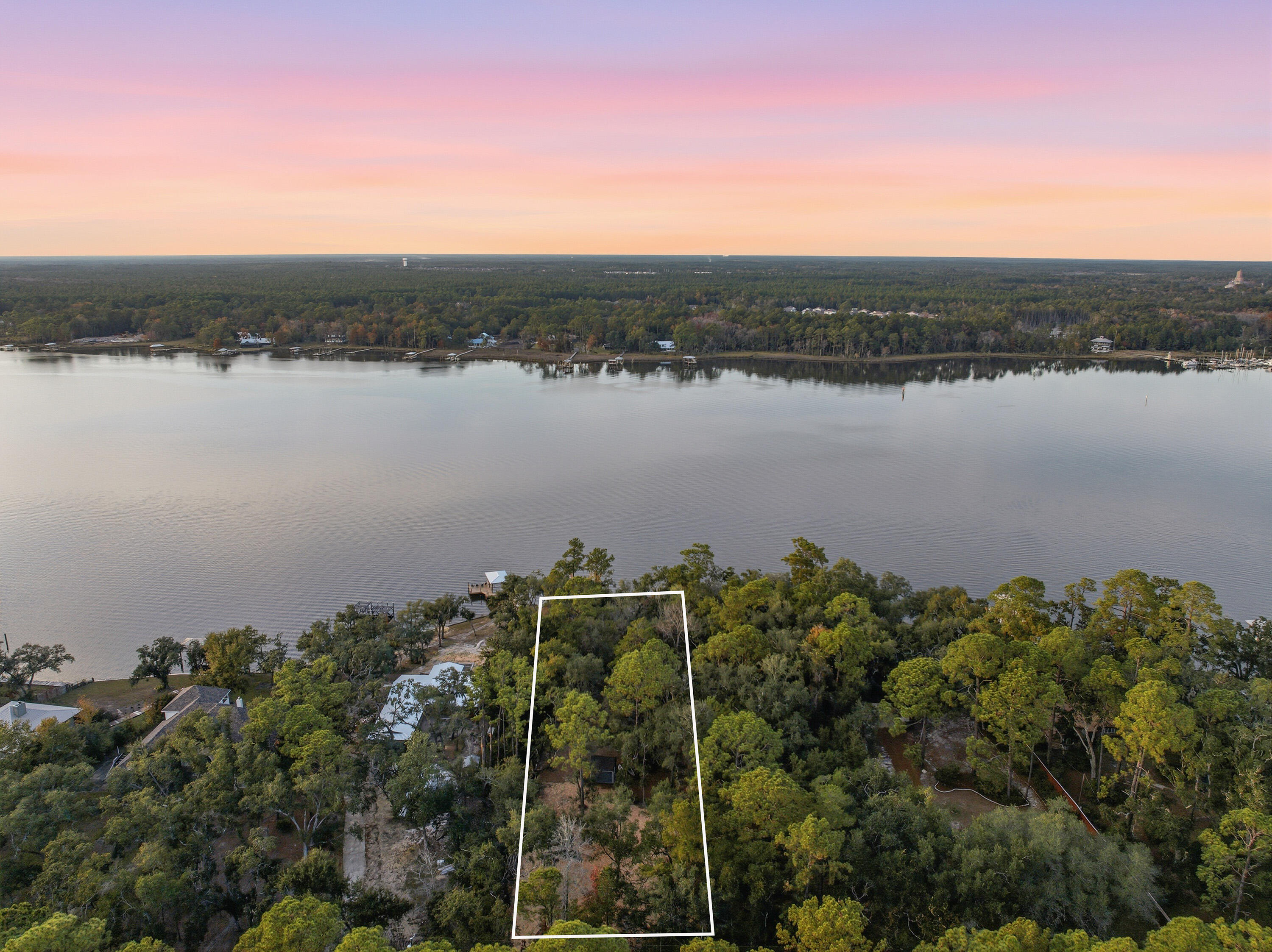 Lot 9 Holly Point Road Freeport, FL 32439 - Photo 3 of 14 a view of a lake with a city
