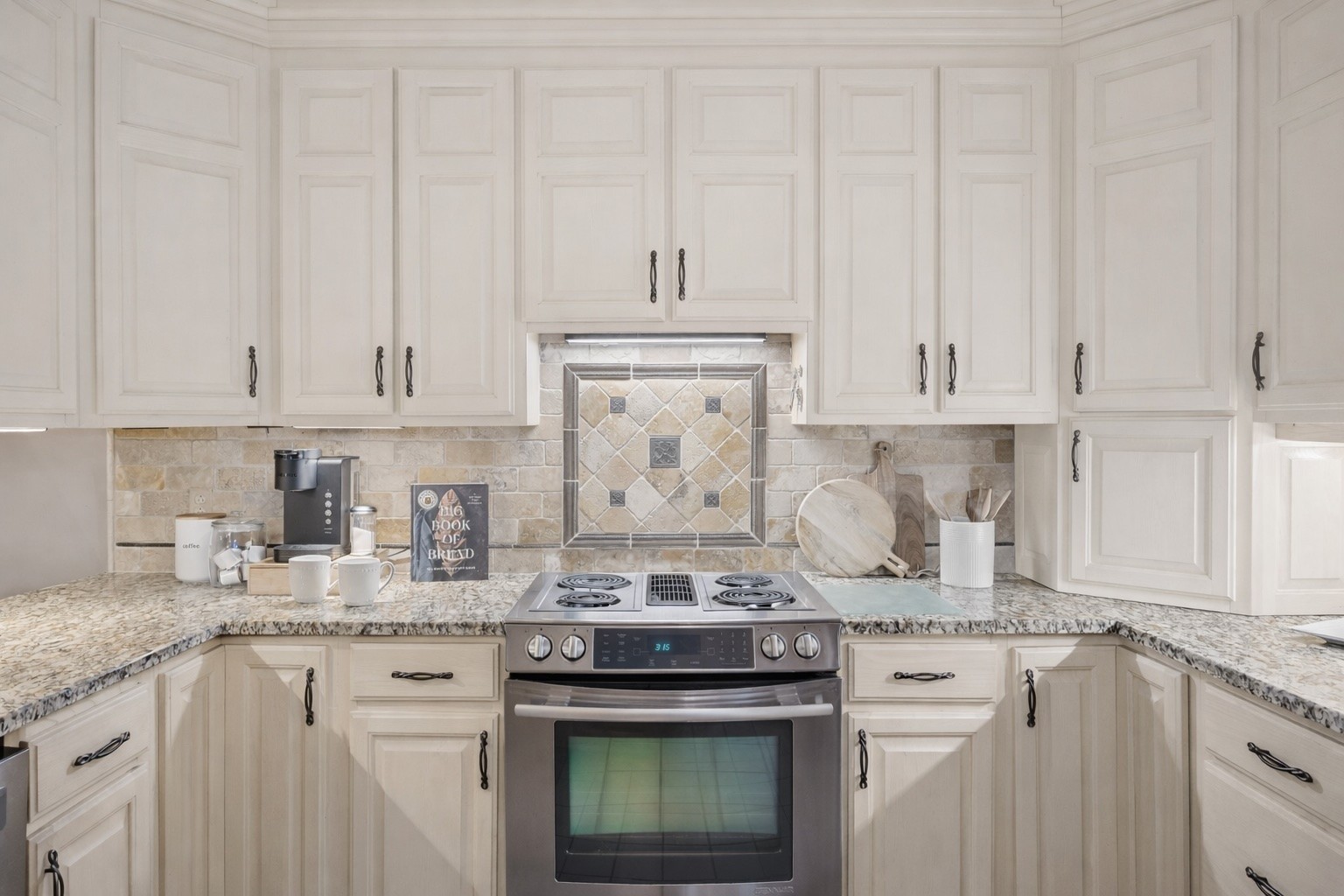 2537 York Road Nolensville, TN 37135 - Photo 23 of 84 a kitchen with granite countertop white cabinets and a stove