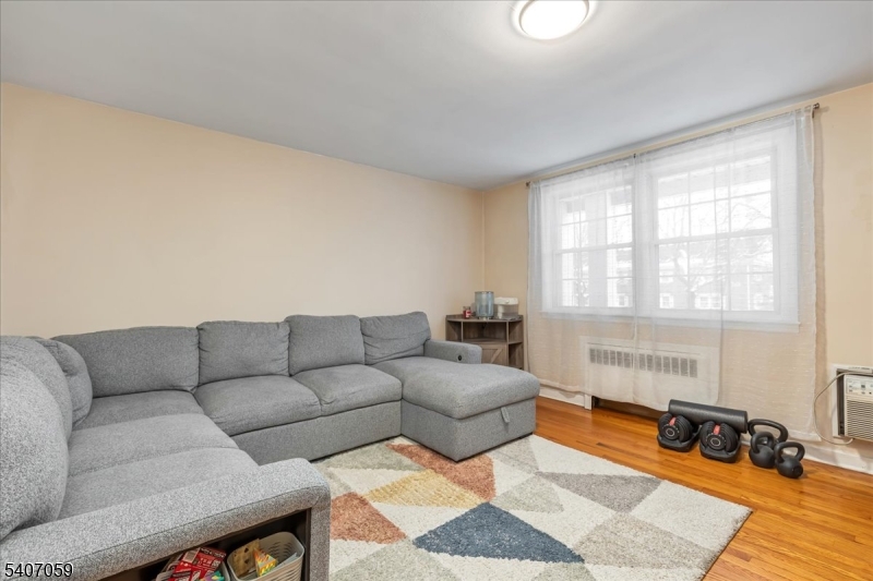 445 Morris Avenue, Unit 4C Springfield, NJ 07081 - Photo 15 of 19 a living room with furniture and a couch