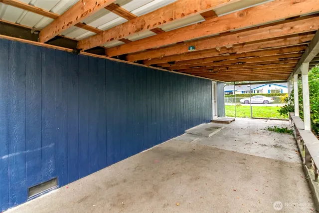 a view of a room with a wooden fence