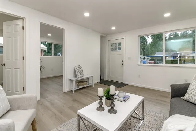 a living room with furniture and a large window