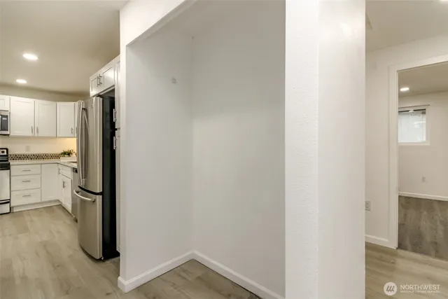 a view of a kitchen with wooden floor