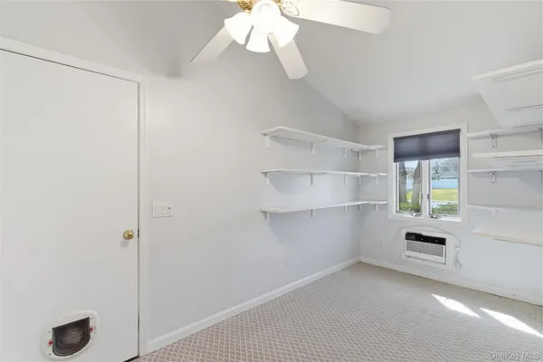 a view of an empty room with a window