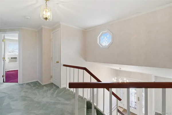 a view of staircase with window