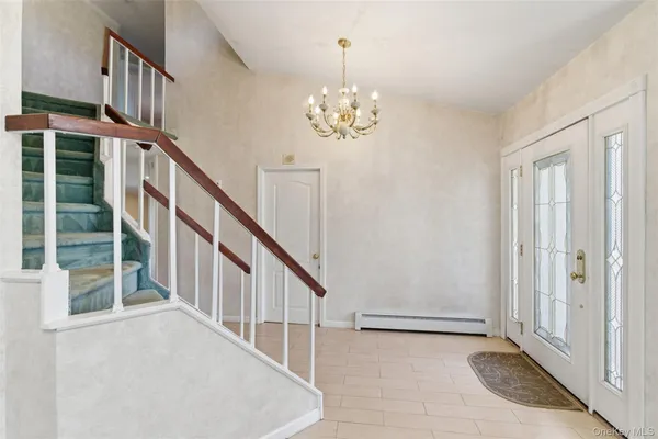 a view of an entryway with staircase