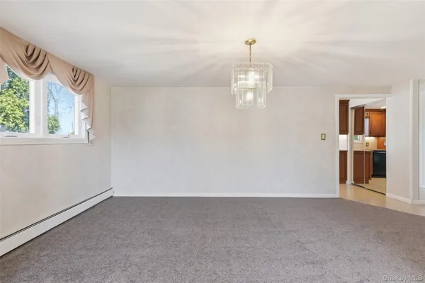 a view of empty room with windows
