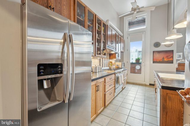 a front view of a house with outdoor seating