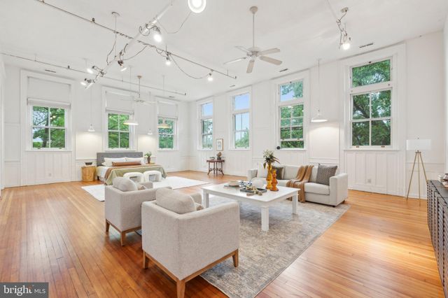 a bathroom with a sink a toilet a shower and a mirror