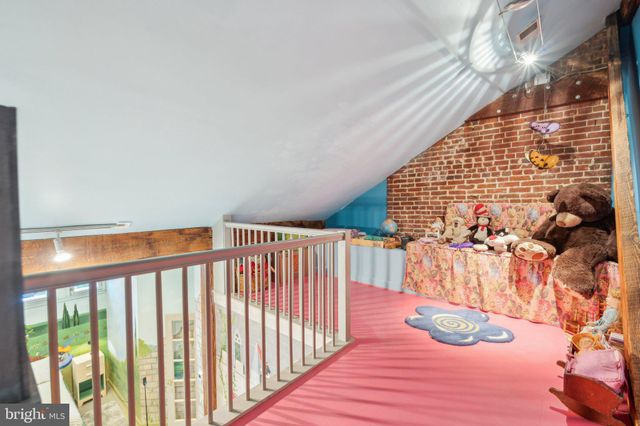 a view of a kitchen with a sink and cabinets