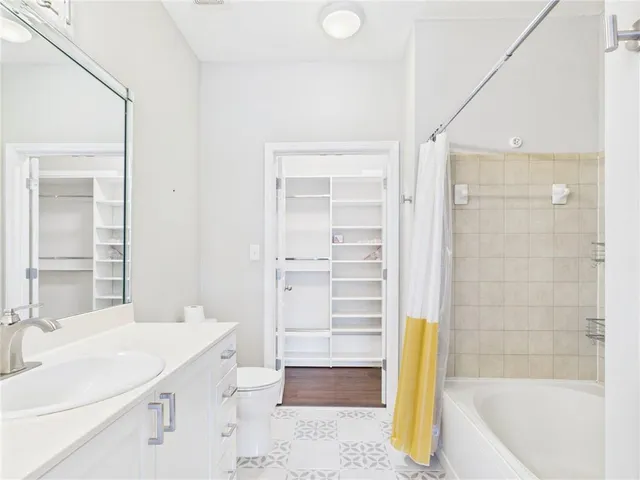 a bathroom with a bathtub and a sink