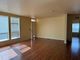355 Colver Road, Unit 24 Talent, OR 97540 - Photo 11 of 21 wooden floor in an empty room with a window