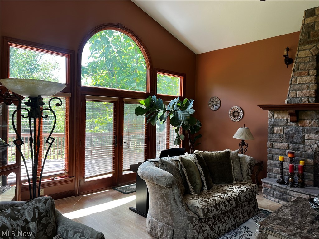 1534 West Comet Road Clinton, OH 44216 - Photo 18 of 43 Living room with a wealth of natural light and lofted ceiling