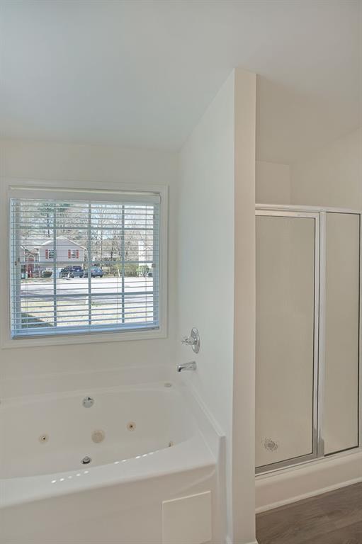 211 West Bridge Drive Dallas, GA 30157 - Photo 17 of 26 a bathroom with a bathtub and a window